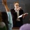 Professor and Student with Hand Raised