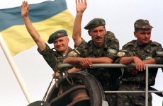 UKRAINIAN PARATROOPERS WAVE AS THEY DEPART FOR KOSOVO.