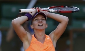 Simona Halep of Romania reacts after winning her women's semi-final match against Andrea Petkovic of Germany at the French Open tennis tournament at the Roland Garros stadium in Paris