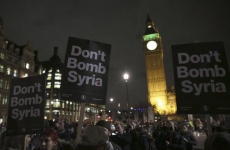 Anti-war protesters demonstrate against proposals to bomb Syria outside the Houses of Parliament in London, Britain